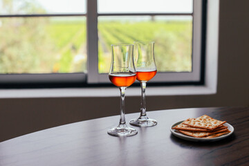 Two glasses of moscatel wine with snacks 