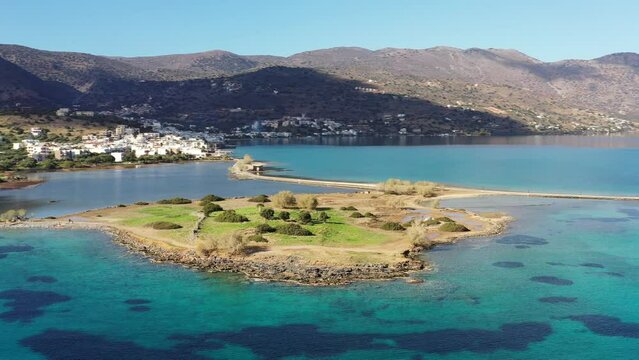 The famous canal of Elounda with the ruins of the old bridge, Crete, Greece.