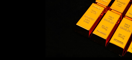 Close up photo a gold bars on black background