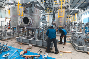 Stainless vertical steel tanks and pipes with pressure meter in equipment tank