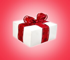 Obraz premium A red beautiful gift box with a ribbon on desk