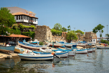 Fototapeta na wymiar Old wooden fishing boats in port of nessebar, ancient city on the Black Sea coast of Bulgaria
