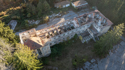 Ruined house. Ruined school building. Abandoned school in the forest