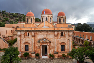 Fototapeta na wymiar Facade of a historic Orthodox church in the historic monastery of Agia Triada on the island of Crete