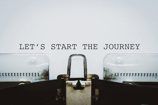 "Let&rsquo;s start the journey" text typed on a vintage typewriter