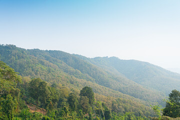 Fototapeta premium Landscape view of mountain at Khao Plung Rest Stop Uttaradit Thailand. Under blue sky.