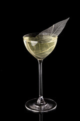 Red line cocktail glass on black background. Alcohol cocktail drink, close-up. Modern alcoholic beverage