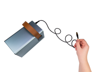 USB cable in hand connected to a large power supply (charging station) on a transparent background. Mobile power supply