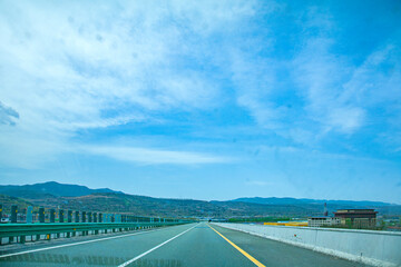 Pingliang City, Gansu Province - Road and field scenery under the blue sky