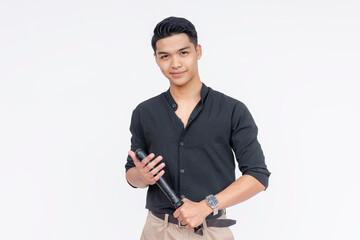 Portrait of a confident young Filipino man with a pleasant smile, dressed in casual black shirt,...