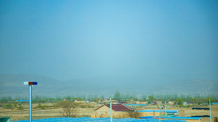 Fototapeta na wymiar Pingliang City, Gansu Province - Road and field scenery under the blue sky