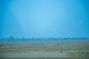 Pingliang City, Gansu Province - Road and field scenery under the blue sky