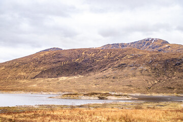Fototapeta na wymiar Majestic Scottish Highlands: A Dance of Earth and Sky