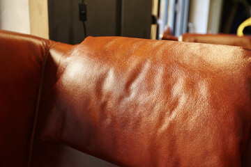 Close up detail of brown leather chair.Selective focus.Texture of leather