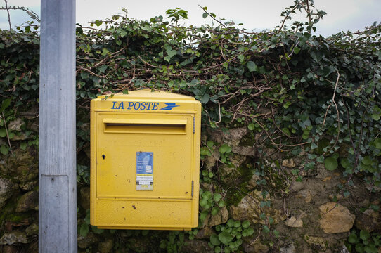 RIONS, FRANCE -15 January 2024- View of a yellow mailbox from La Poste, the French public postal service, High quality photo