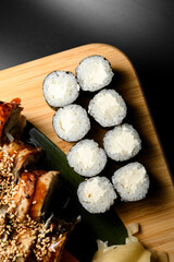 Top view of maki sushi rolls with cream cheese next to another view of sushi rolls