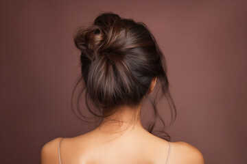 Hair care, beauty and back of woman in studio with shiny, clean and messy dirty hairstyle. Health, self care and model with knots before keratin hair treatment by brown background 