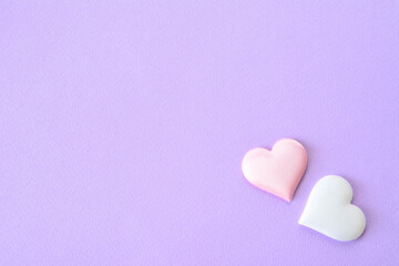 pink and white hearts in the corner of lilac postcard 