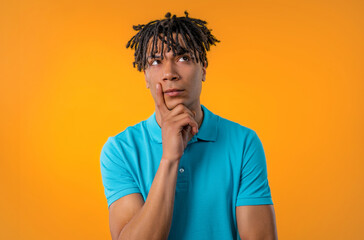 Thinking around man on yellow background. Smart student guy finding answer