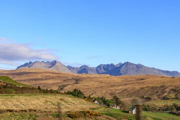 Breathtaking Landscape of Rolling Hills and Majestic Mountains