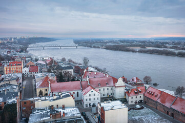 Fototapeta na wymiar Granaries of Grudziadz city by the Vistula river at snowy winter. Poland