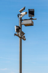 Security camera on the public road. Video surveillance and lighting systems.Surveillance with security cameras on the street for the safety of citizens.