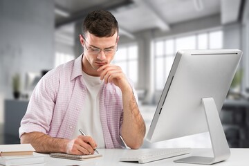 Middle aged professional businessman sitting at desk in office