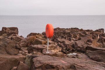 Case box with life belt in case of drowning people near coastal sea cliffs