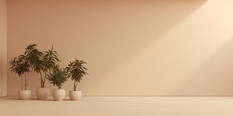Plants in a vacant beige space.