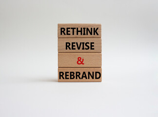 Rethink Revise and Rebrand symbol. Wooden blocks with words Rethink Revise and Rebrand. Beautiful white background. Business and Rethink Revise and Rebrand concept. Copy space.