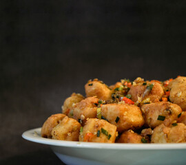 Tahu cabe garam, made from white tofu which is covered in flour and then fried and sautéed with chopped chilies, spring onions and chopped garlic. vegetarian healthy food.