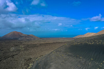 Aerial view of Timanfaya, National Park, Caldera Blanca. Panoramic view of volcanoes, mountains and vineyards, Lanzarote, Canary Islands, Spain