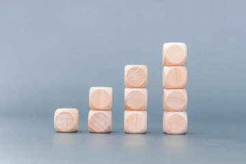 Place wooden blocks as a step towards the goal. Isolated on gray background. Business ideas for successful growth process.