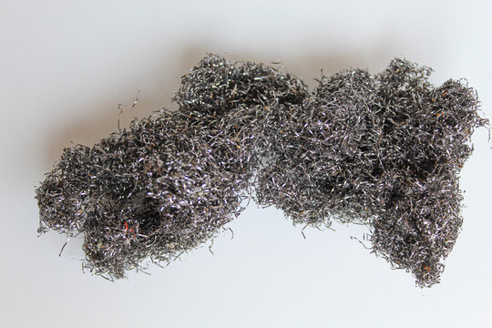 Steel sponge for dish washing, isolated on white background