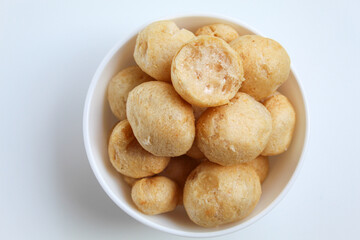 Bitten fish crackers in ball shape. isolated on white background, flat lay or top view