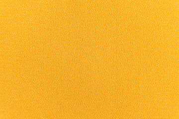 Polyester synthetic fabric top view, macro fiber yellow fabric