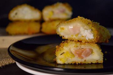 The Indonesian version of risoles or risoles is filled with mayonnaise, sausage, corn and boiled egg wrapped in a crepe-like wrapper and coated in breadcrumbs and deep-fried. selected focus.