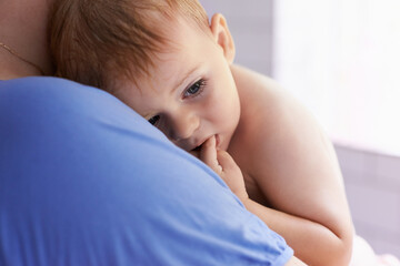 Parent, comfort and holding baby with calm, sleepy or tired in home with support and care. Person,...