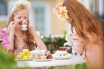 Girls, children and friends at tea party in nature for fantasy play for cake, birthday or game....