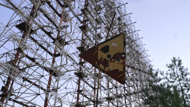 View of Duga horizon radar systems through radiation sign, Chernobyl, Ukraine