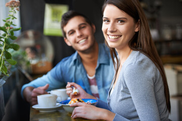 Smile, portrait and couple eating in cafe, love and bonding together on valentines day date in the morning. Happy face, man and woman in restaurant with breakfast coffee drink, food and relationship - Powered by Adobe