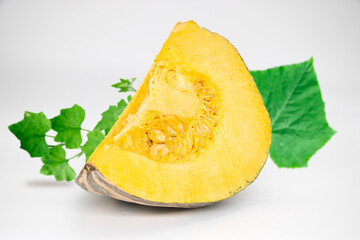 Sliced pumpkin chunks isolated on white background