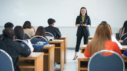 Education, teaching, learning concept. Asian university lecturer teaching lesson to students in...