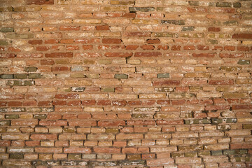 Panoramic background with wide texture of antique red brick wall. Design background for home or...