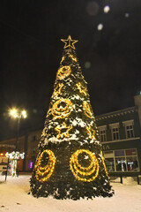 Christmas tree against the background of the market square in Lubliniec. Christmas 2023.