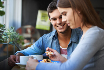 Food, happy and couple eating in cafe, care and bonding together on valentines day date in the...