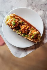 vegan croquettes sandwich in restaurant on table