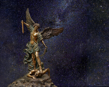 St Michael the Archangel bronze statue against a backdrop of the milky way star field