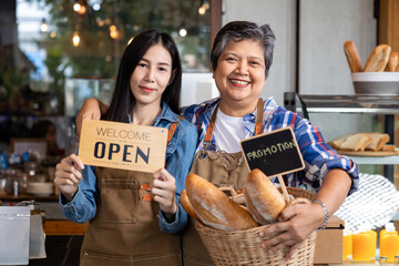 Asian elderly, senior, pensioner, female and daughter open cafe restaurant small business shop at...