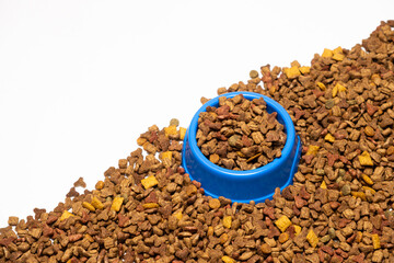 Fototapeta na wymiar Dry food for puppies close-up. Complete diet for dogs during their first year of life